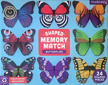 Butterfly shaped memory match game box cover by mudpuppy, featuring 24 butterfly-shaped pieces on a light blue background with a central red title card.